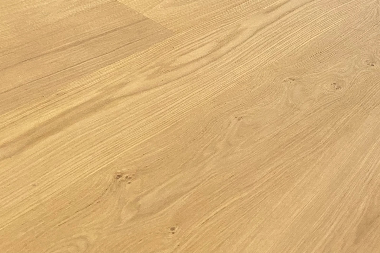 Pale wide-plank European oak floor with a natural matte finish, milled and installed by Cal Coast Flooring